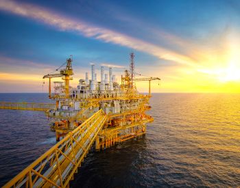 Getty Images 1185828689 - Rig plantform and Supply vessel in the gulf