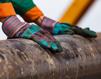 Gloves on a rusty pipe